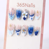 Uñas postizas francesas 3D con diseño floral azul marino y sal marina de 365Nails.