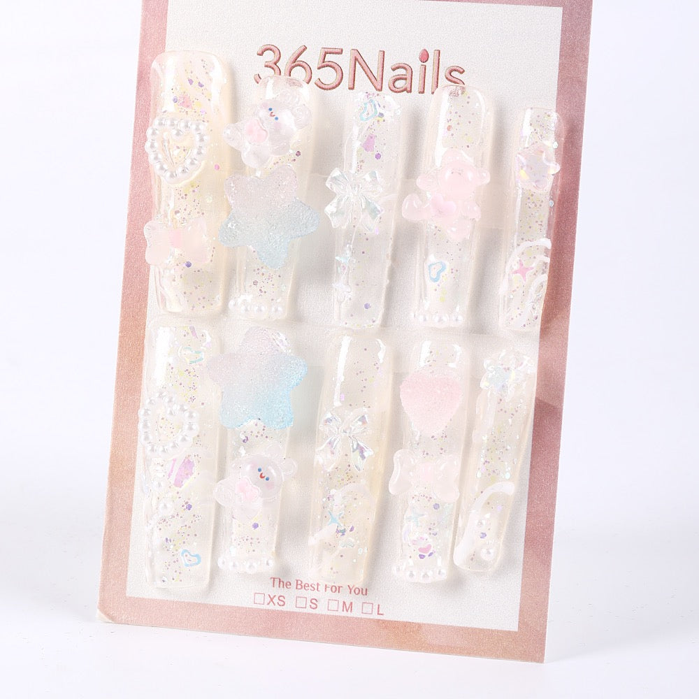 365Nails Iridescent Jelly Long Coffin Press On Nails with 3D Stars, Bows and PearlsSold in packs of 5. Minimum order: 1 pack (5 pcs). Quantity = number of packs. Qty 1 = 5 pcs