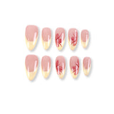 Uñas postizas almendradas 365nails con base color nude, francesa amarillo mantequilla y flores pintadas a mano.