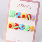 Uñas postizas cuadradas cortas pintadas a mano con diseño Bubble Pop de 365Nails.