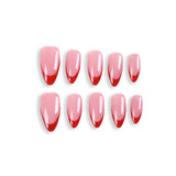 Uñas postizas almendradas 365Nails, color rosa nude con punta francesa roja.