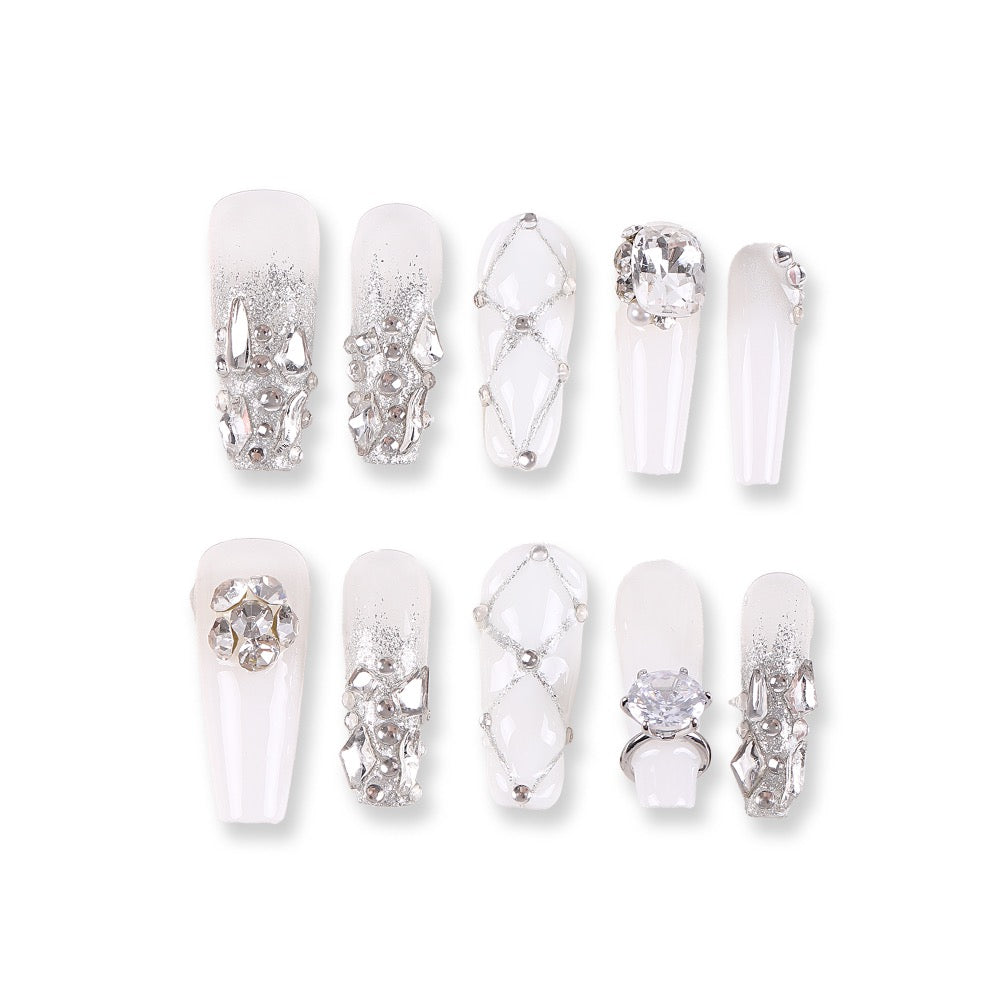 365Nails Icy Milky White with Silver Luxe—Metal Shards, Crystal Rhinestones and Glitter Lattice – Glam Medium-Long Coffin Press-On NailsSold in packs of 5. Minimum order: 1 pack (5 pcs). Quantity = number of packs. Qty 1 = 5 pcs
