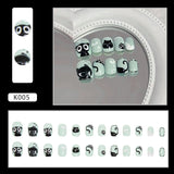 Unhas infantis de gatinho preto fofo com base verde fresca |365nails