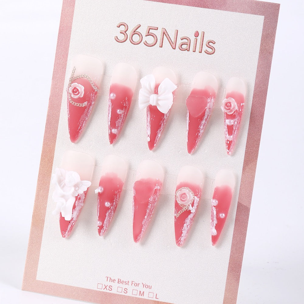 Uñas postizas de estilete 365Nails Milky Cherry Ombré con lazo y rosa.