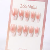 Uñas postizas largas de ataúd 365Nails con efecto degradado rosa, perlas y cutículas brillantes.