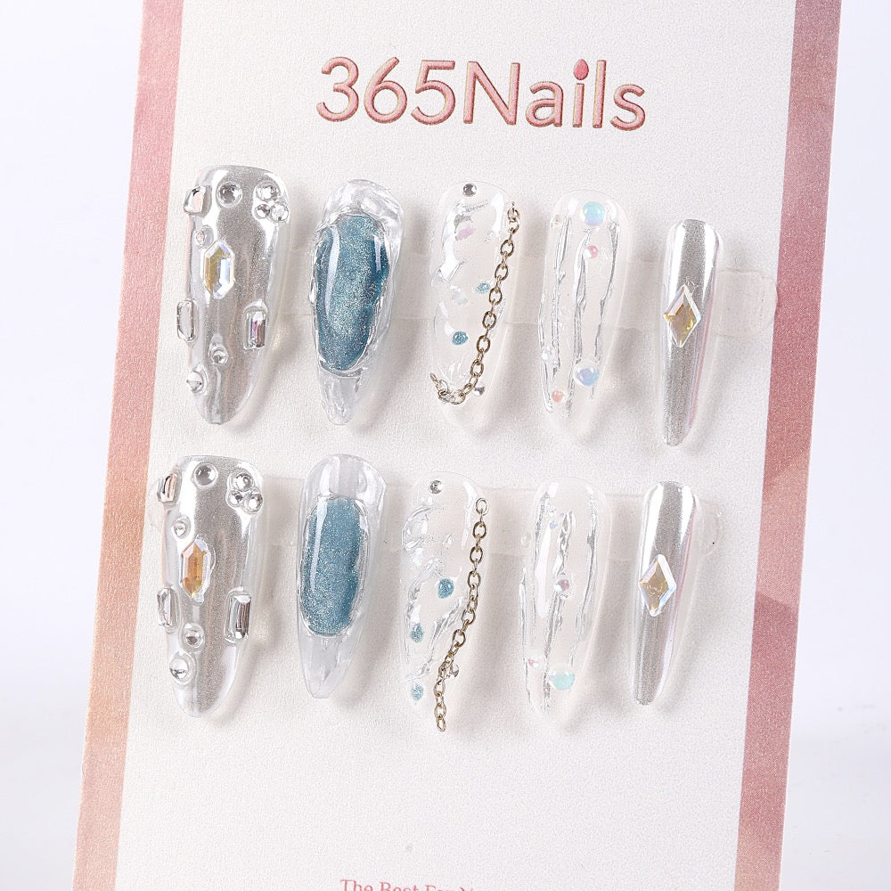 365Nails Crystal Jelly Long Stiletto Press On Nails in Silver with Chains and GemsSold in packs of 5. Minimum order: 1 pack (5 pcs). Quantity = number of packs. Qty 1 = 5 pcs