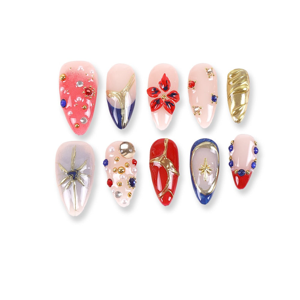 365nails nude base mix with blue-red-gold stars & gems almond press-onsSold in packs of 5. Minimum order: 1 pack (5 pcs). Quantity = number of packs. Qty 1 = 5 pcs
