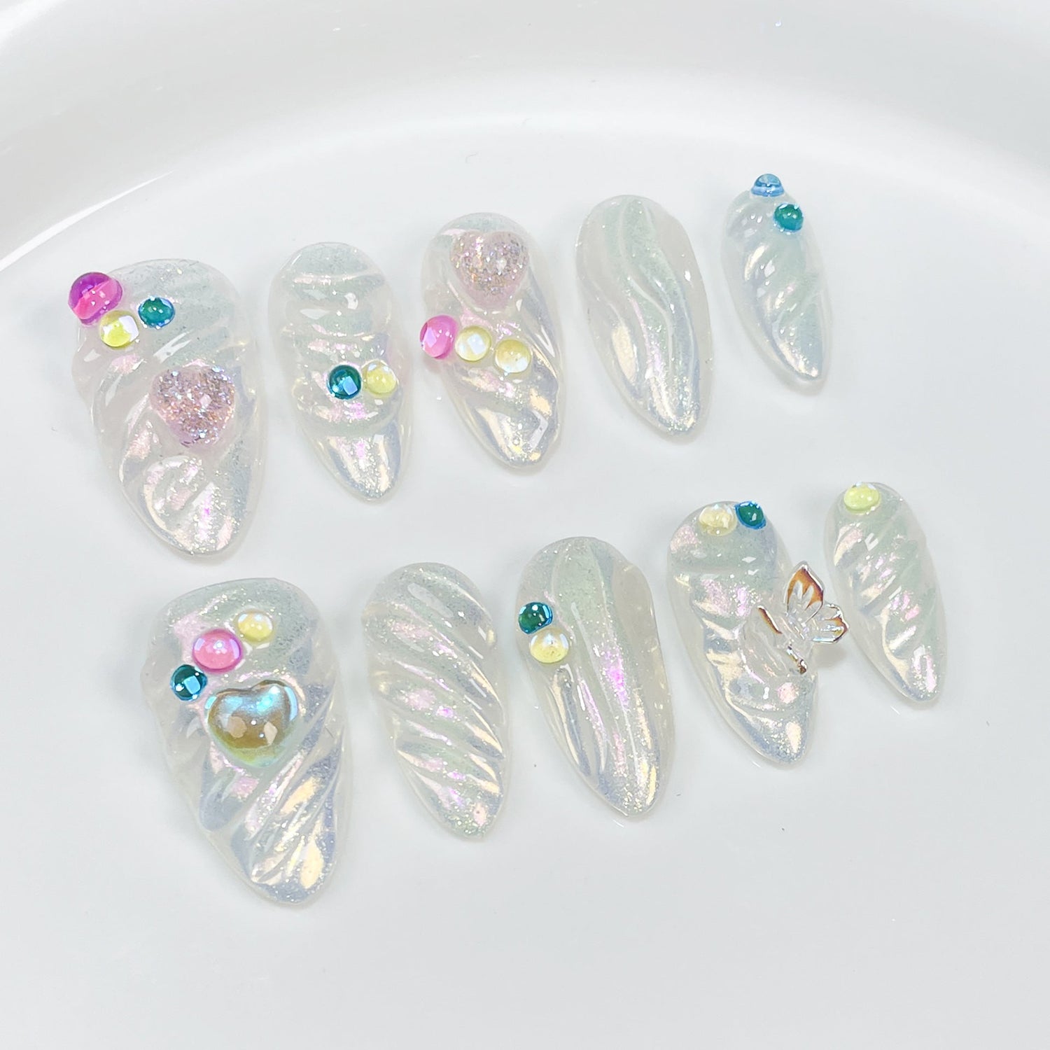 Aurora summer press-on nails with colorful candy 3D sculpting and iridescent almond medium design, ideal for custom ODM collection inspiration.