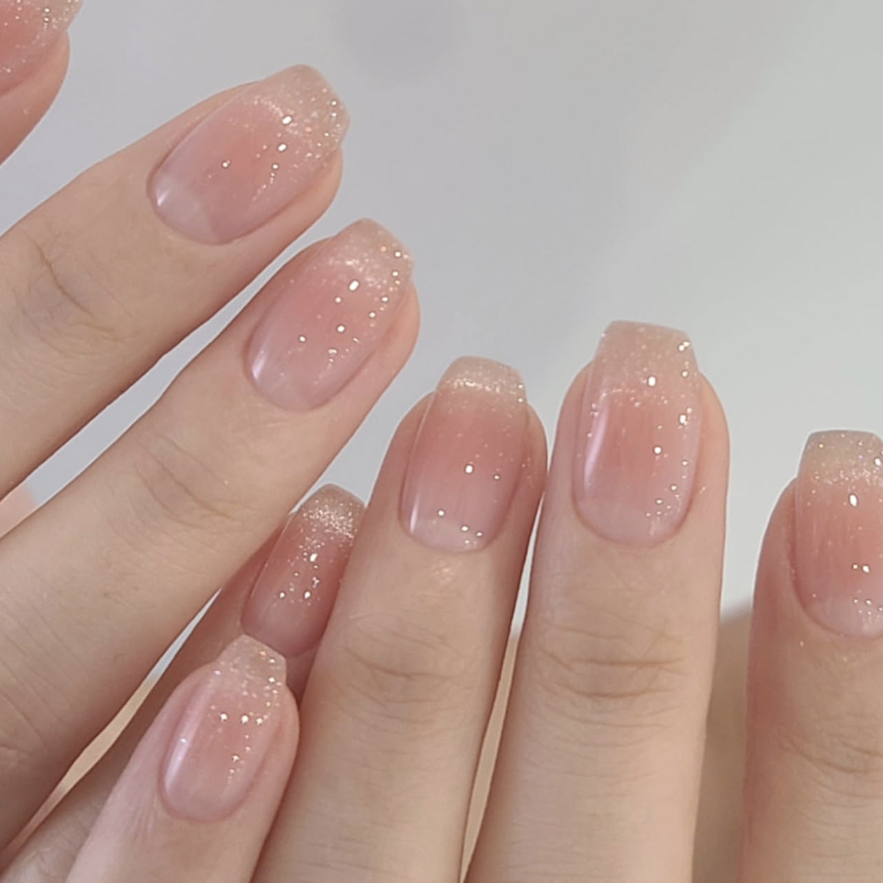 Soft nude gradient glitter squoval press-on nails set – ideal for testing dropshipping product quality and showcasing consistent brand finish.