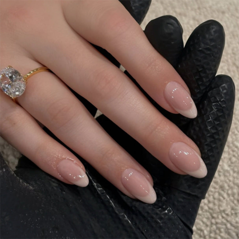 Classic Milky French press-on nails with a glossy finish on a hand, suitable for private-label packaging design inspiration.