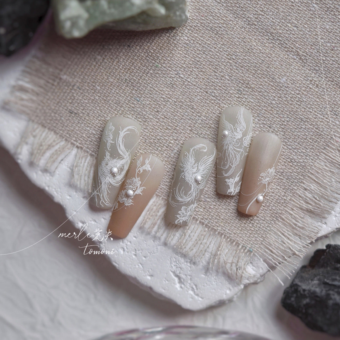 Wholesale press-on nail set with holographic crystal butterfly accents and clear nail tips, showing multiple sizes for salon retail.