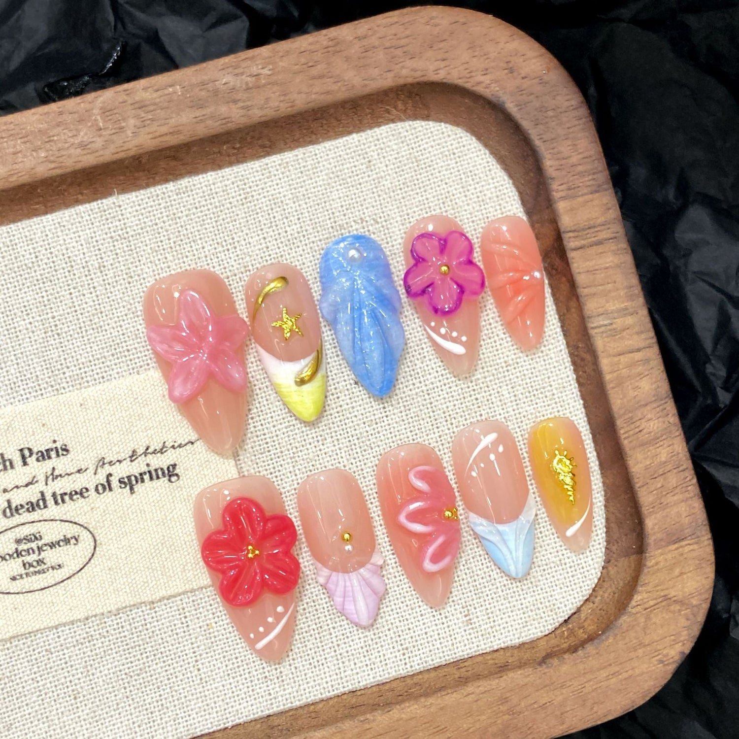Custom 3D floral handmade press-on nail design on a blooming garden theme, ideal for beauty brands launching unique collections.
