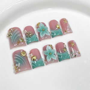 Aqua Bloom Seashell Series Press-On Nails in blue and gold on neutral background, suitable for salon retail wholesale assortment.