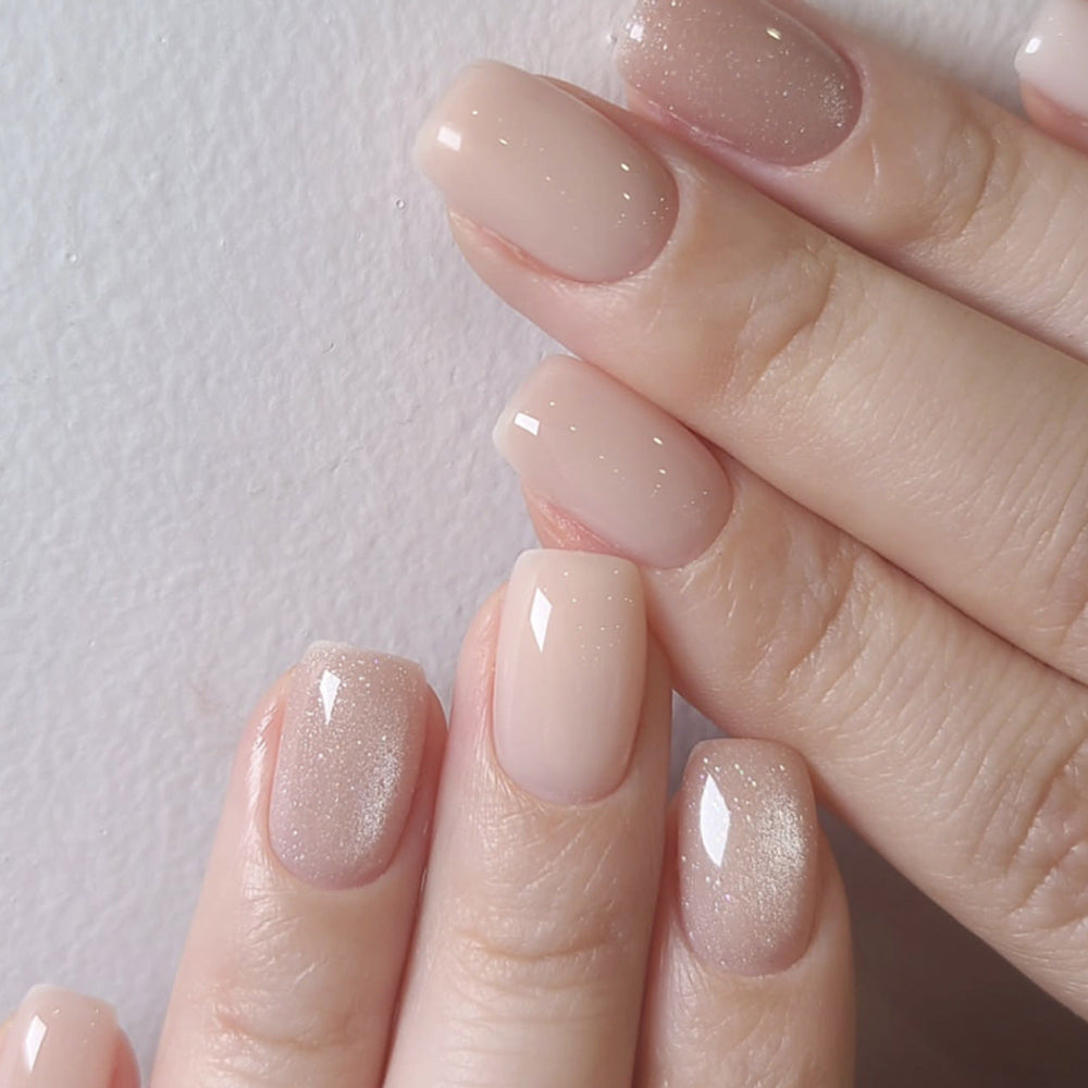 Soft nude gradient press-on nails with subtle shimmer, sized set for private-label fit guidance.