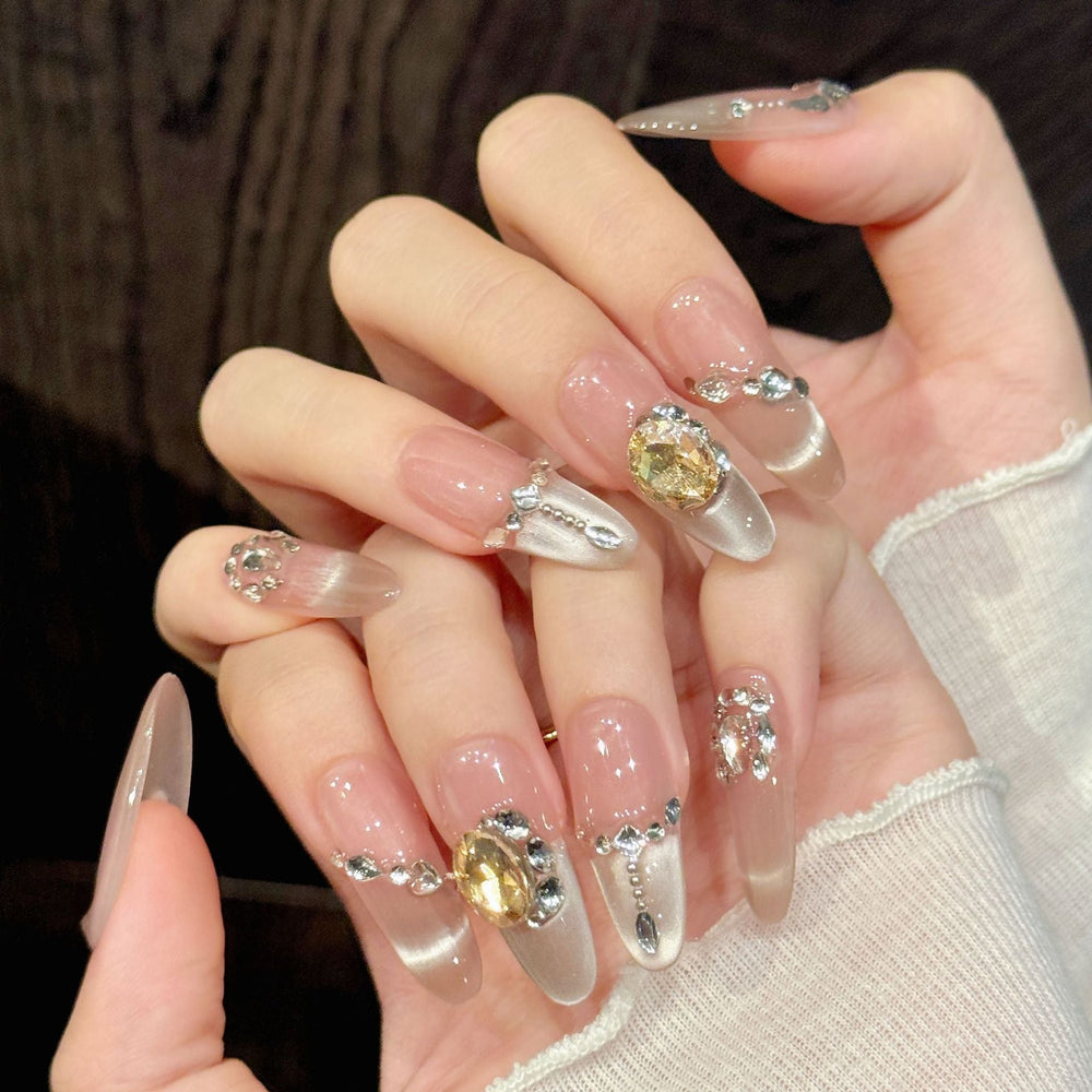 Elegant nude crystal gem press-on nails with shimmer finish shown on a plain background for private-label packaging mockups.