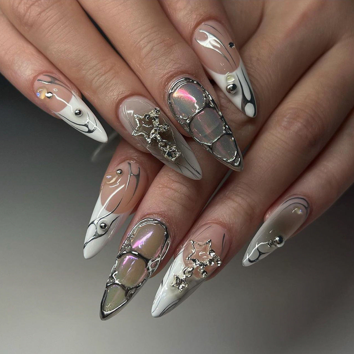 Y2K cyberpunk chrome French stiletto press-on nails with 3D charms, representing a trendy fall private label nail collection