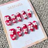 Sculpted Flora: "Crimson Blossom" – 3D White Floral & Red Base Long Almond Nails