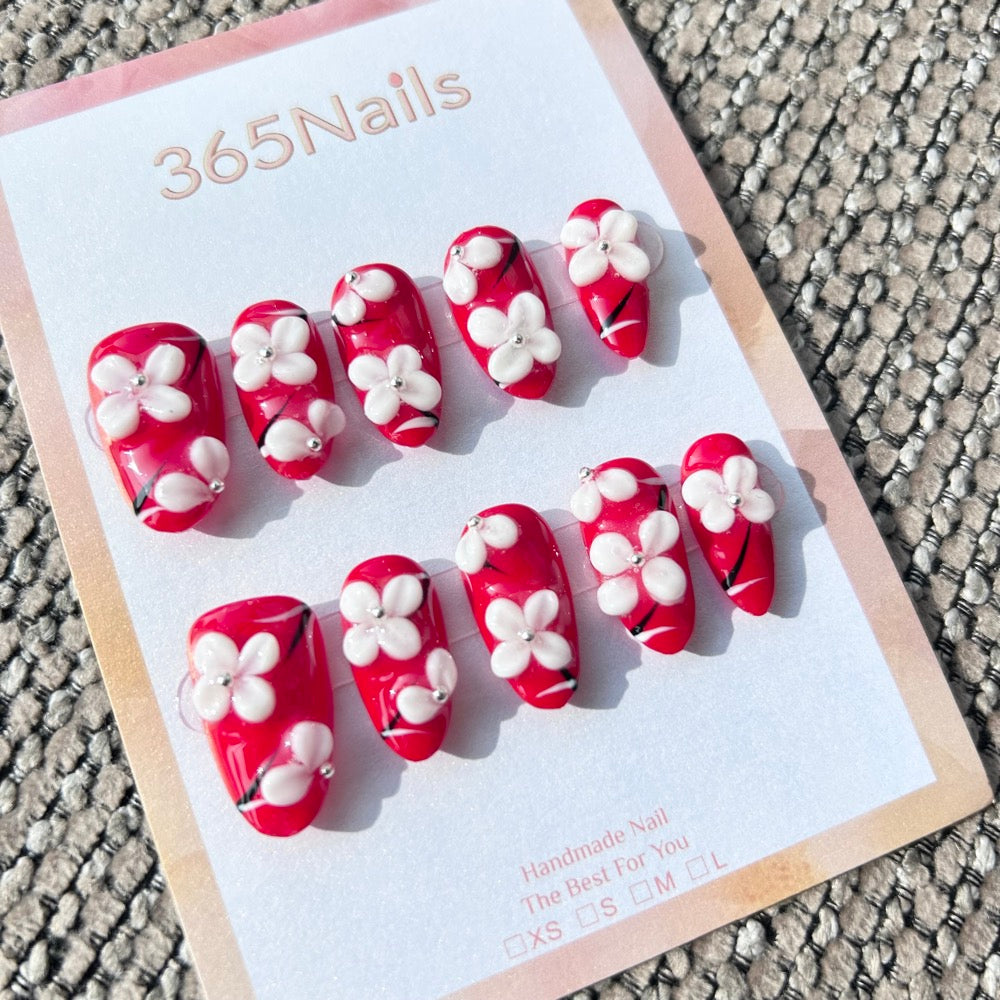 Sculpted Flora: "Crimson Blossom" – 3D White Floral & Red Base Long Almond Nails