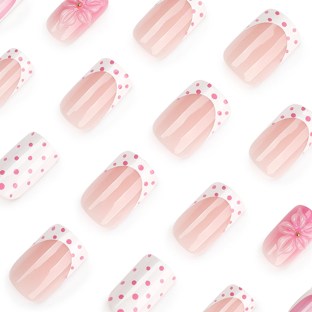 Close-up of square pink and white polka dot press-on nails with 3D flower accent