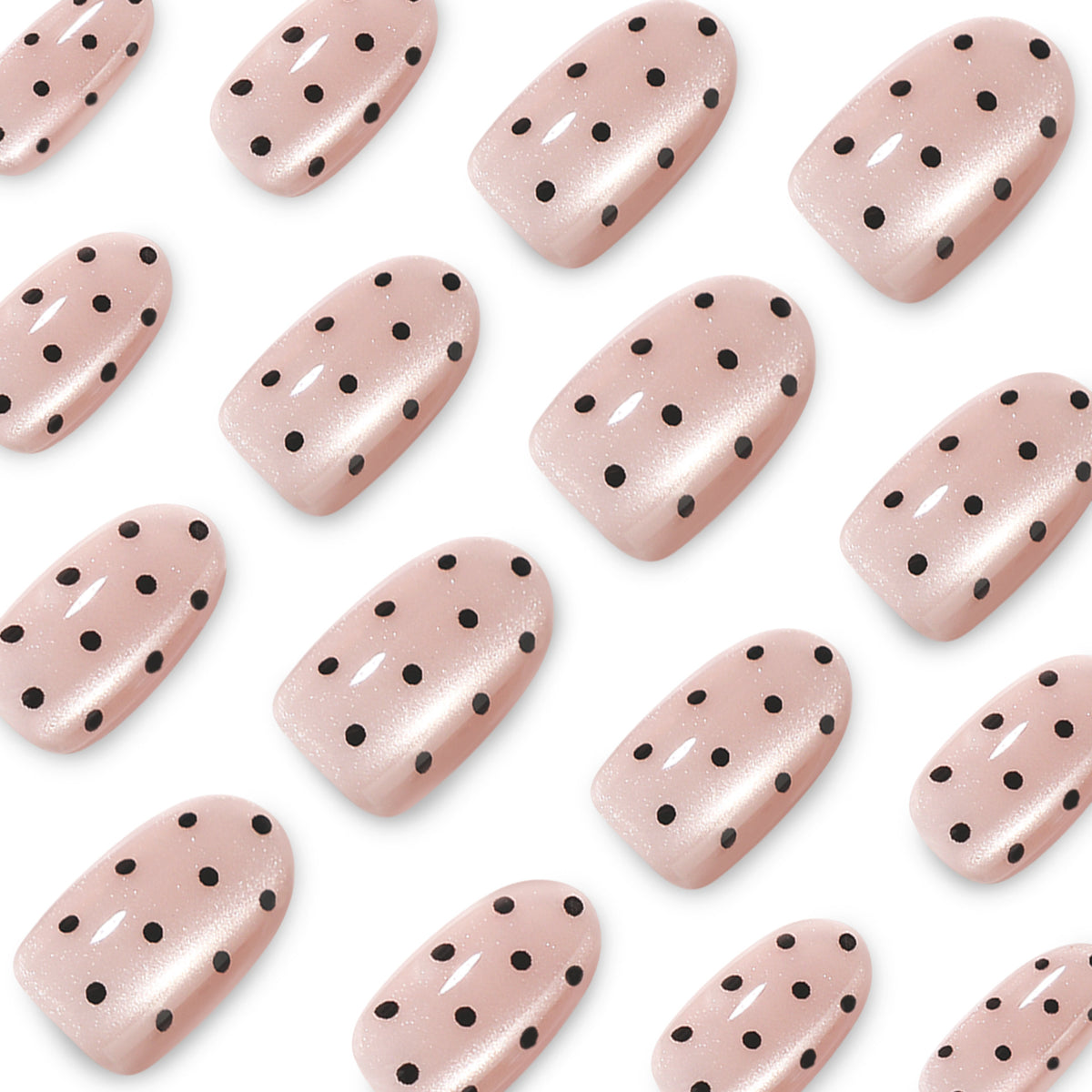 Close-up of glossy nude pink nails with black dots and shimmer