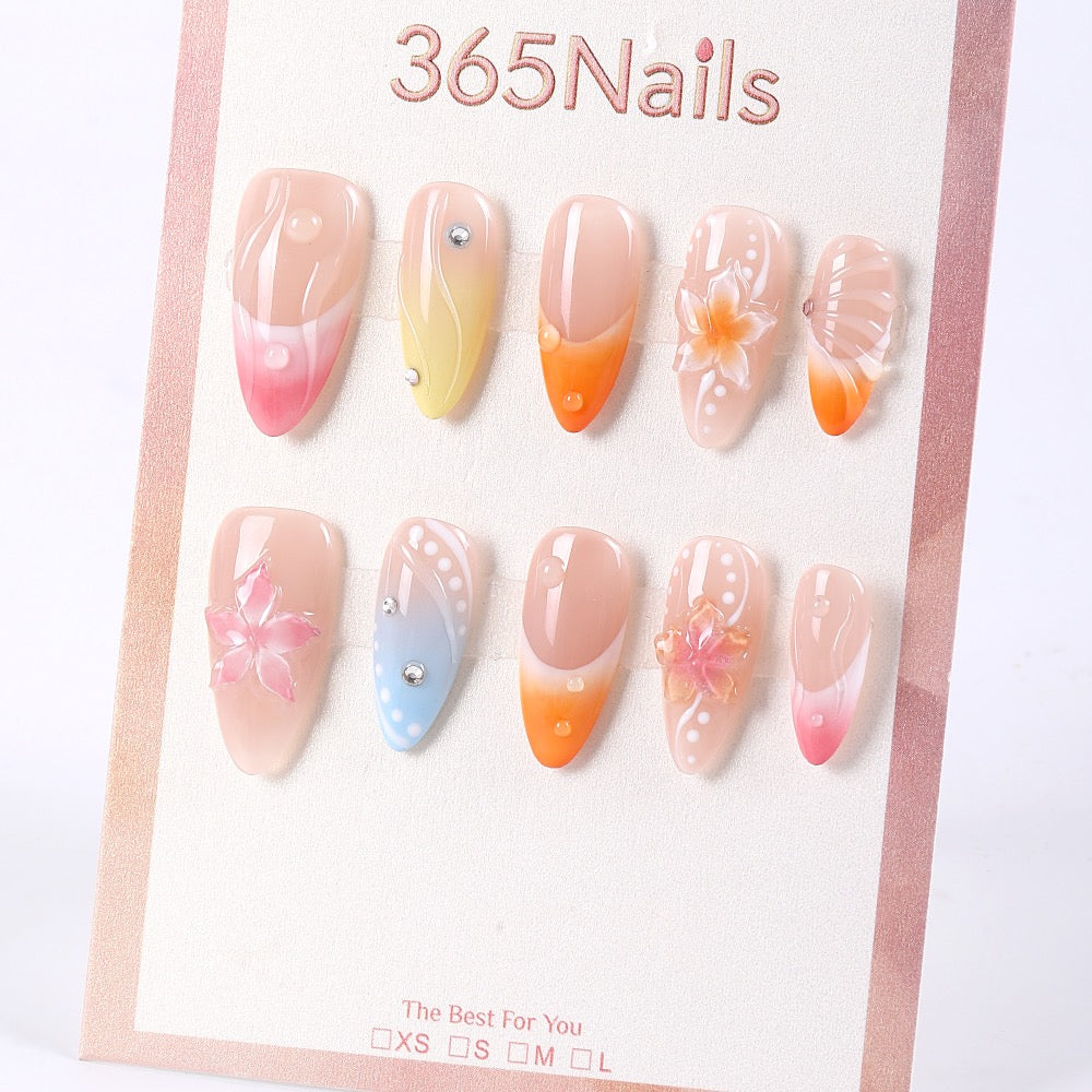 Uñas postizas 365nails de verano, color pétalo de gelatina degradado con cristales diminutos.