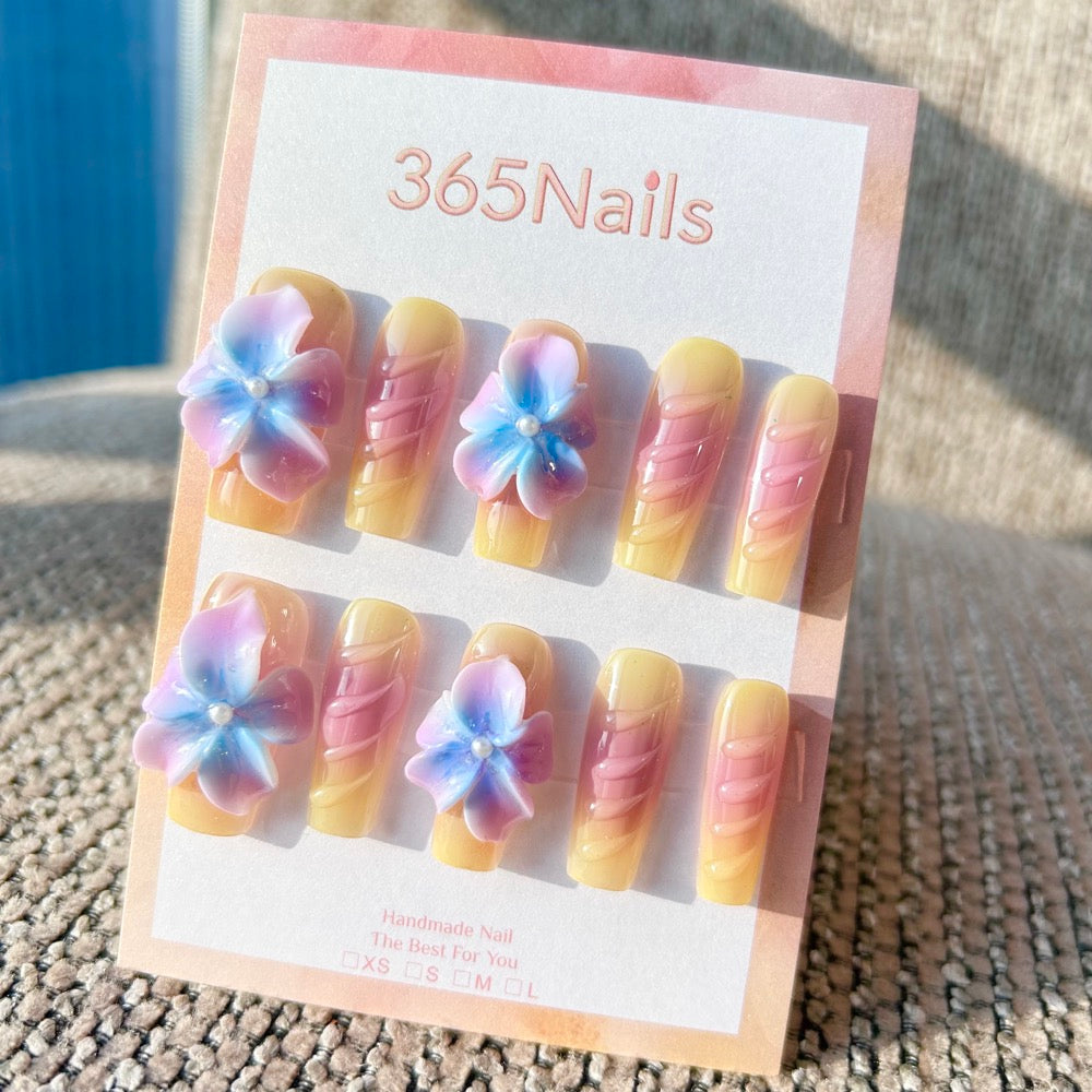 Sculpted Flora: "Dreamy Pastel Flora" – 3D Gradient Purple & Blue Flowers on Yellow-Pink Ombre Coffin Nails with Textured Ribs