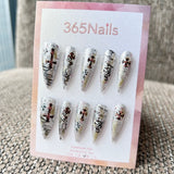 Femme Fatale: "Gilded Rebel" – Silver Holographic Glitter Base with Bronze Crosses & Black Leopard Graffiti Long Stiletto Nails