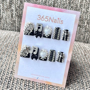 365nails : "Rock punk star musique pics et strass" – Ongles carrés mi-longs avec charme métal 3D faits main