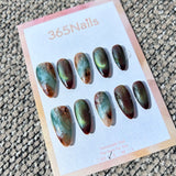 Ethereal Ink: "Aurora Jade Amber" – Deep Burgundy Cat Eye & Teal-Brown Marble with Silver Shimmer Almond Nails