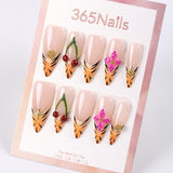 Uñas postizas 365Nails con diseño de punta de tigre y flor de cerezo.
