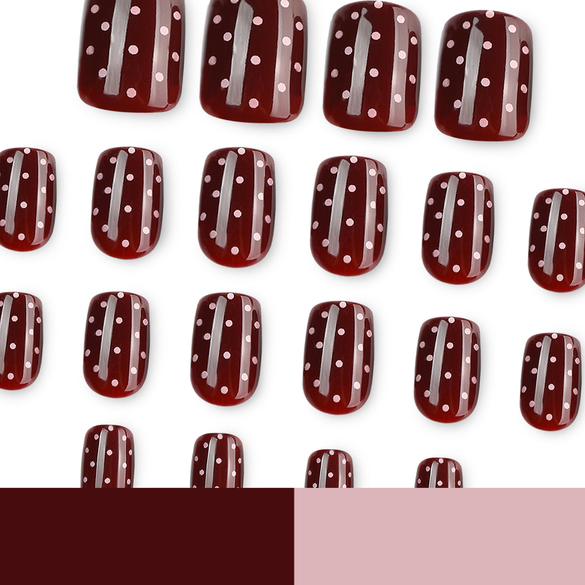 Many dark red polka-dot press-on nails displayed on a white background.