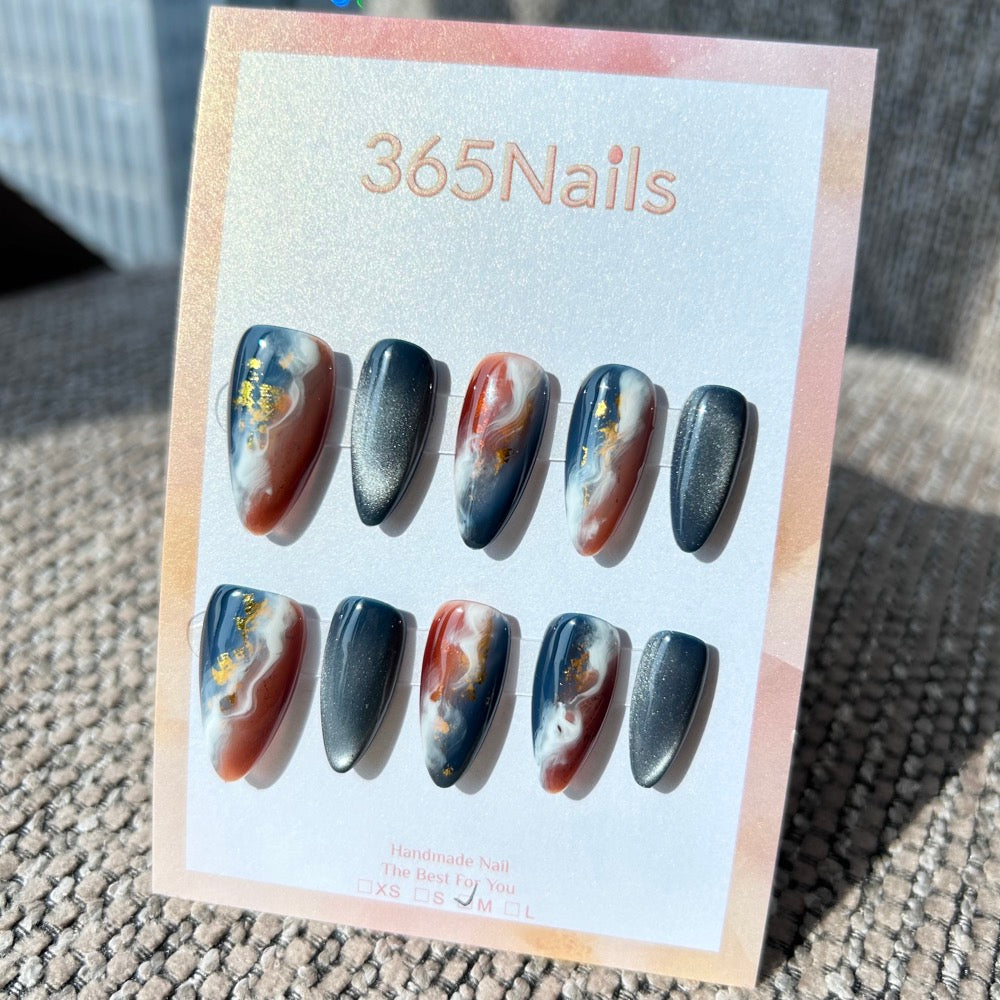 "Midnight Magma" – Navy Blue Cat Eye & Amber Russet Ink Marble with Gold Foil Almond Nails