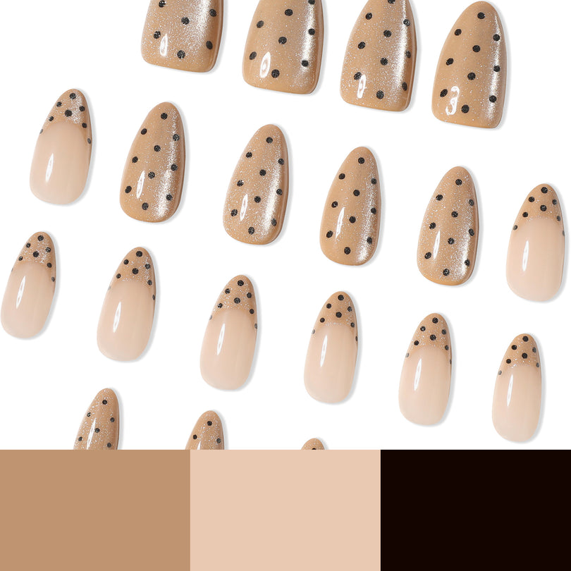 Many nude dotted press-on nails laid out with beige, nude and black color swatches below