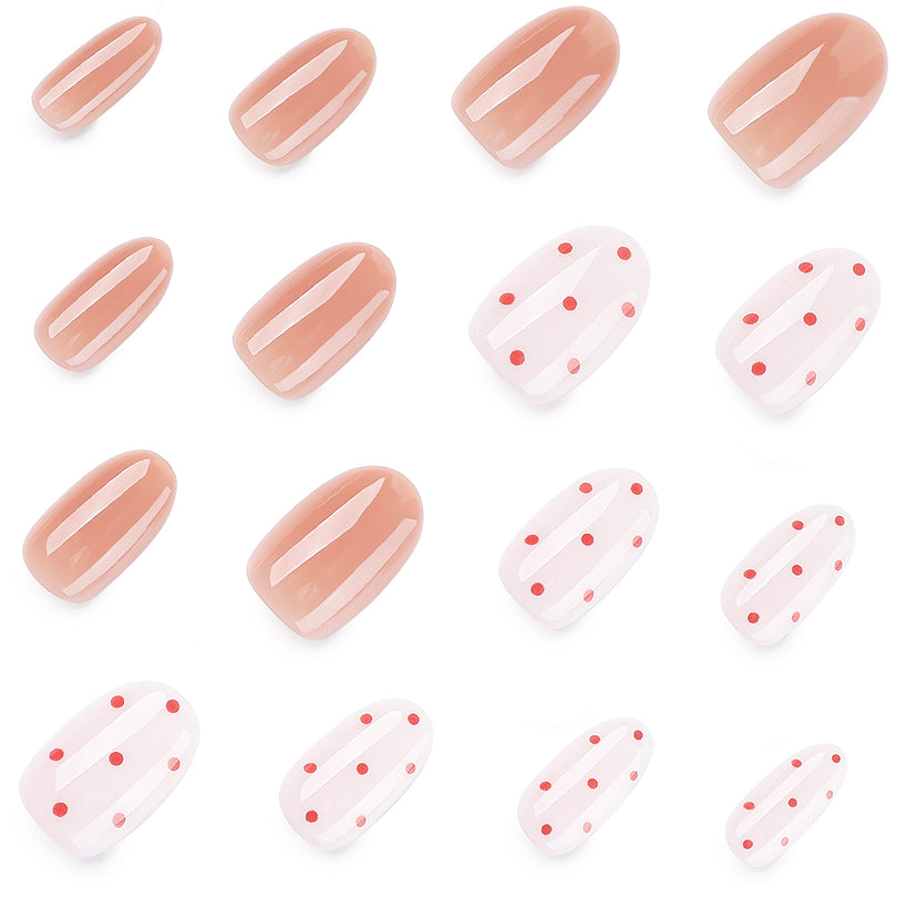 Close-up of short round press-on nails in pink and dotted designs