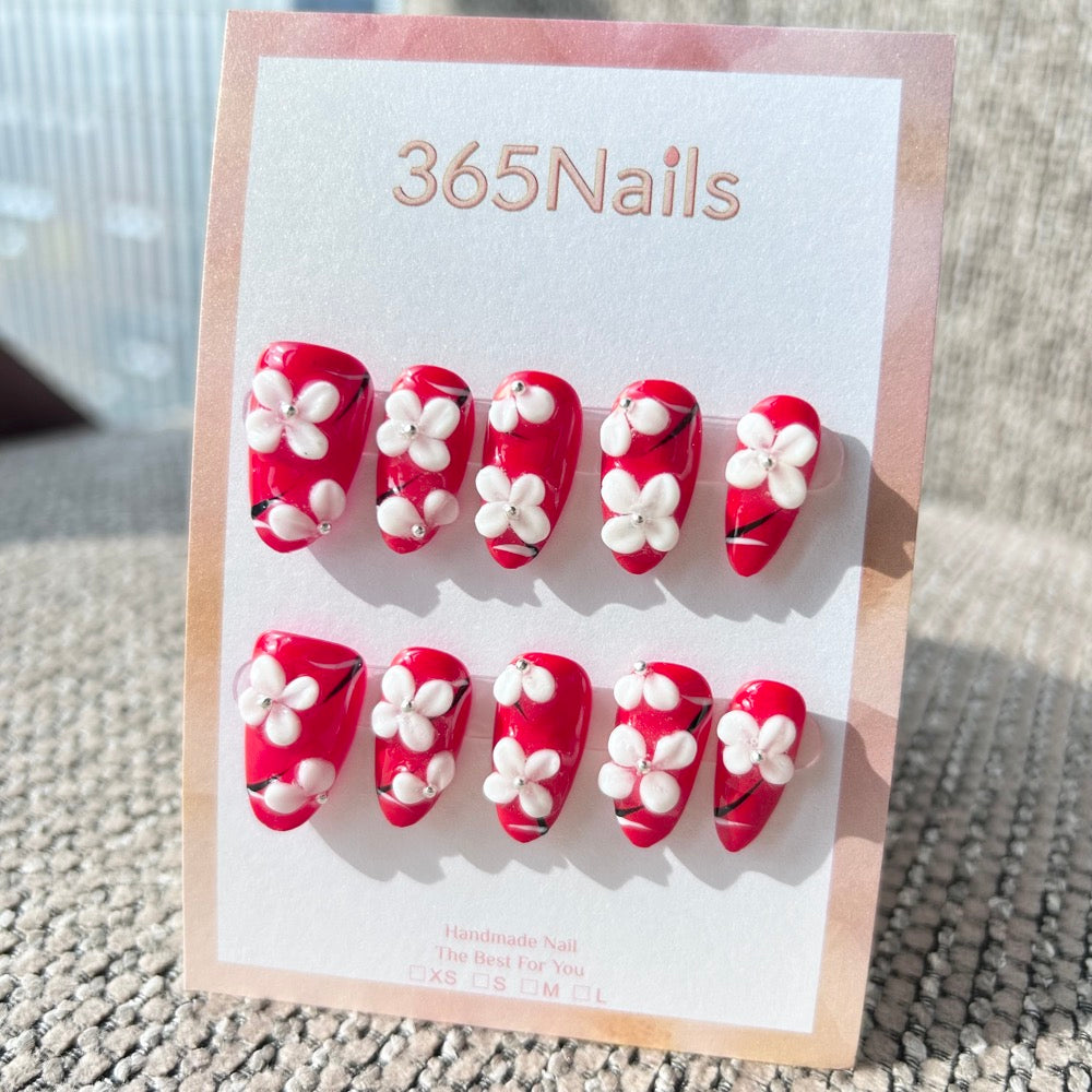 Sculpted Flora: "Crimson Blossom" – 3D White Floral & Red Base Long Almond Nails