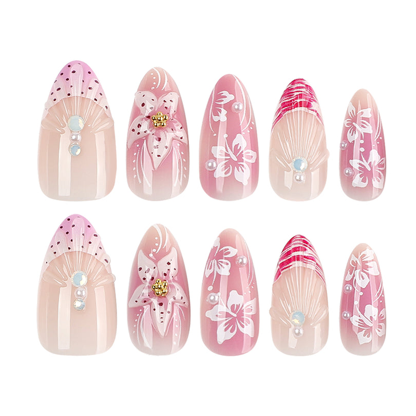 Two rows of pink floral press-on nails with 3D flower accents