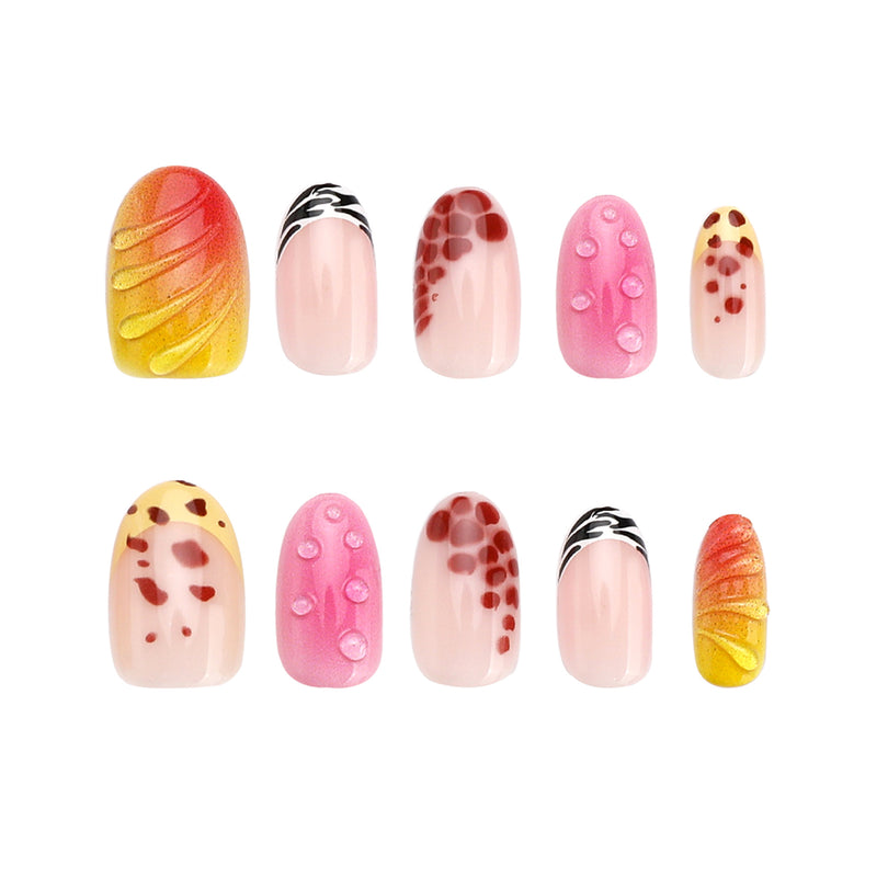 Ten press-on nails arranged in two rows with animal print and 3D details