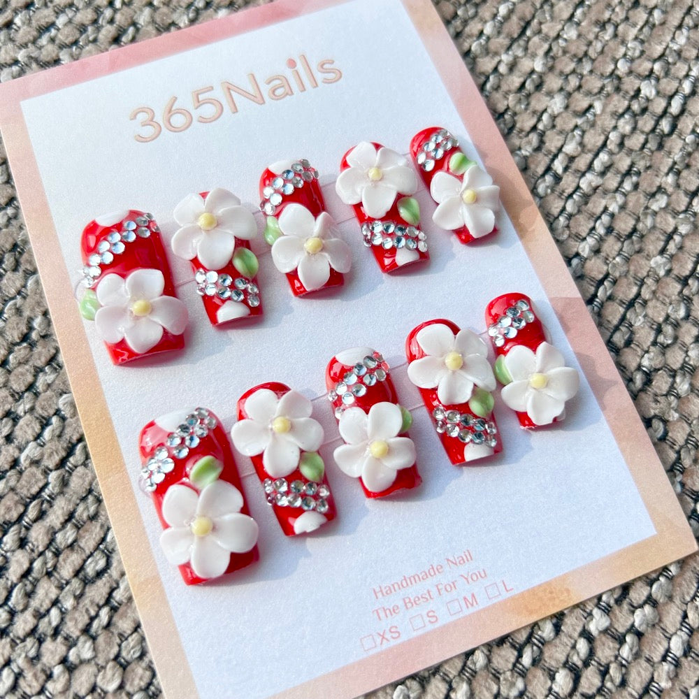 Sculpted Flora: "Ruby Floral Bling" – 3D White Flowers & Rhinestones on Classic Red Square Nails