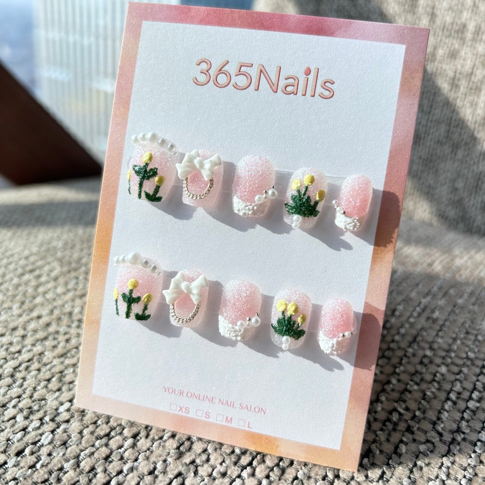 Sweet & Dopamine: "Sugar Pink Tulip" – Glitter Pink Base, 3D Yellow Tulips, White Bow & Pearl Chain Press-on Nails