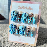 Sculpted Flora: "Azure Leopard Cross" – 3D Blue Flower with Leopard Print & Silver Cross Charm Coffin Nails