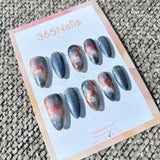 Ethereal Ink: "Frostfire Ink" – Blue-Grey Cat Eye & Rust Red Marble with Silver Lines Almond Nails