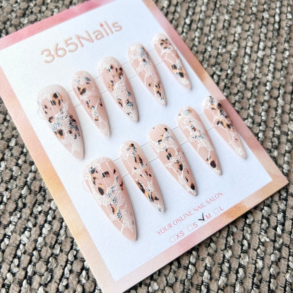 Femme Fatale: "Wild Lace" – Nude Base with Leopard Print & White Fishnet Lace Overlay Long Stiletto Nails