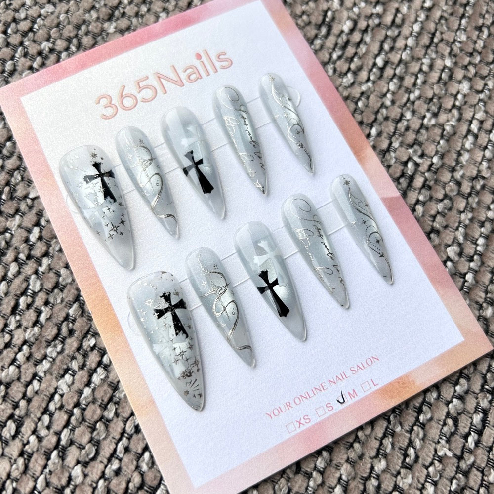 Femme Fatale: "Icy Scripture" – Translucent Blue-Grey Base with Silver Lettering, Gothic Crosses & Stars Long Stiletto Nails
