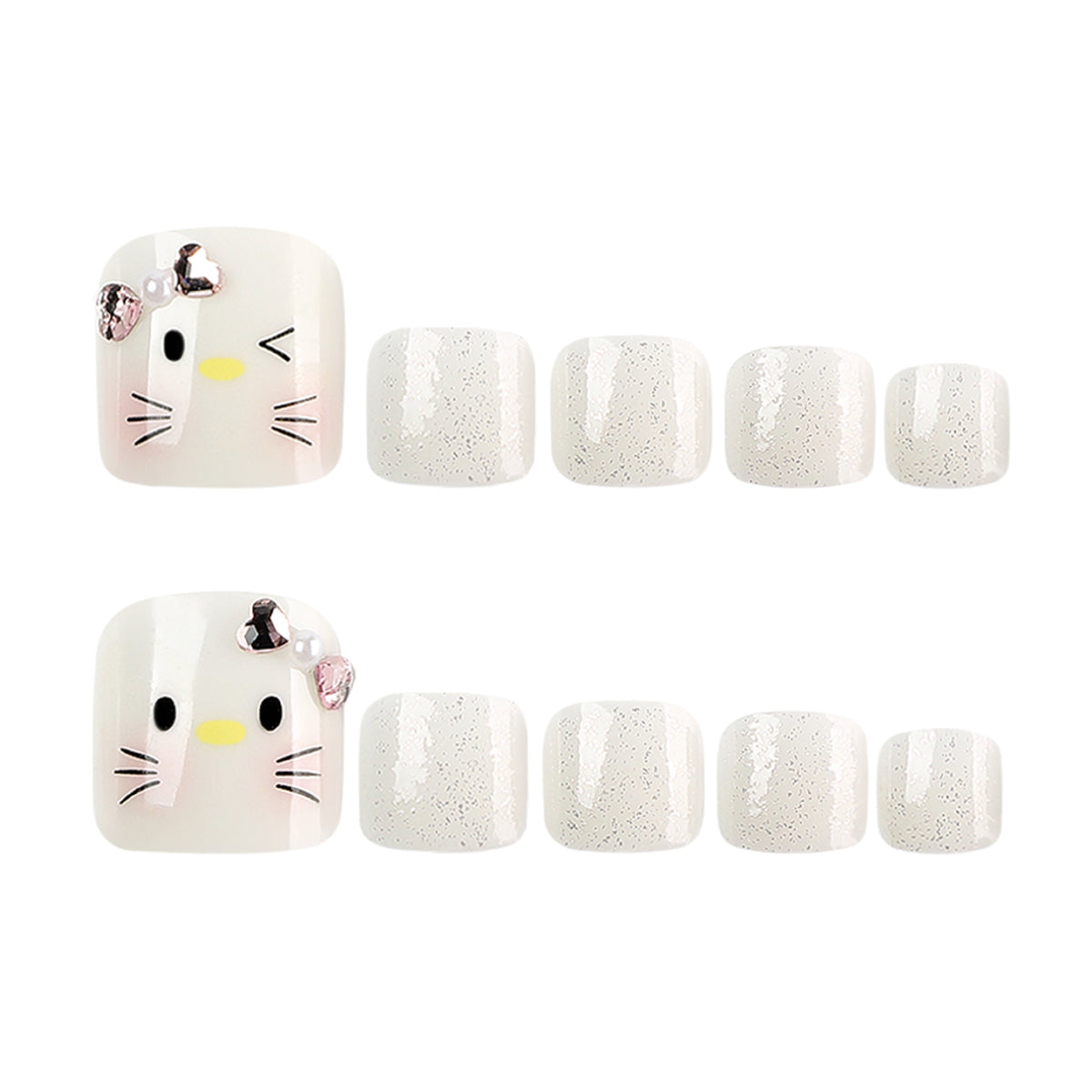 Two cat-face press-on toenails displayed with rows of silver glitter accent nails.