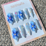 Sculpted Flora: "Frosty Bluebell Dream" – 3D Gradient Blue Flowers on Pearlescent White Nails with Aurora Gems