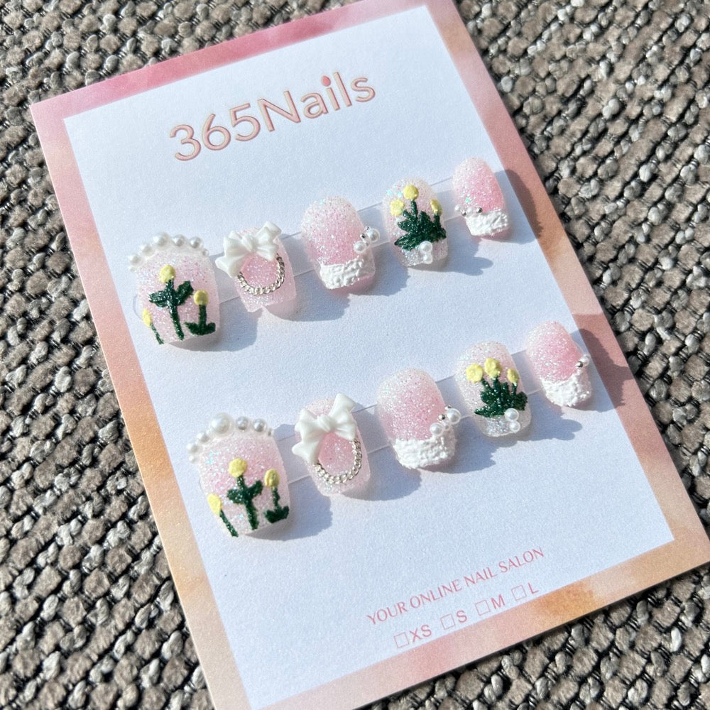 Sweet & Dopamine: "Sugar Pink Tulip" – Glitter Pink Base, 3D Yellow Tulips, White Bow & Pearl Chain Press-on Nails