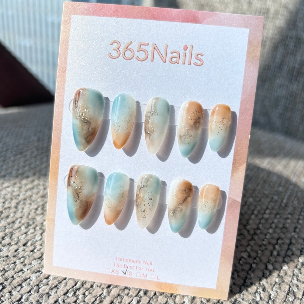 Ethereal Ink: "Coastal Amber" – Icy Blue & Caramel Sand Marble with Gold Flakes & Ink Smudge Almond Nails