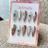 Femme Fatale: "Chrome Saint" – Icy Aurora & Metallic Bronze Mix with 3D Gothic Cross & Liquid Silver Lines Long Stiletto Nails