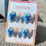 Sculpted Flora: "Ice Blue Velvet" – 3D Blue Flower & Red-Blue Polka Dot French Stiletto Nails with Rhinestones
