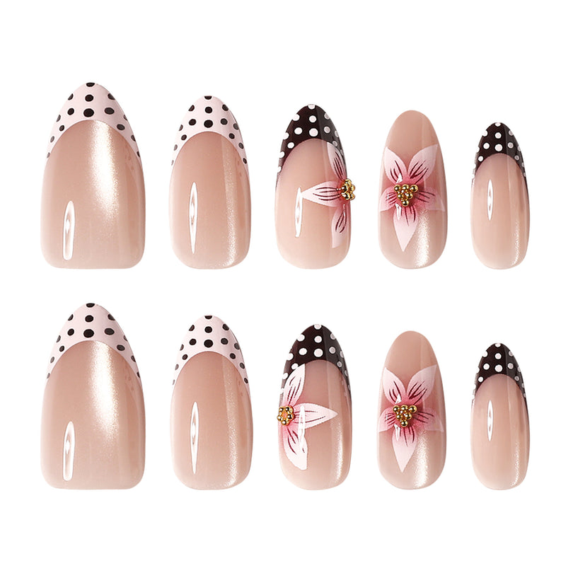 Two rows of almond press-on nails with dotted tips and 3D gold bead flowers
